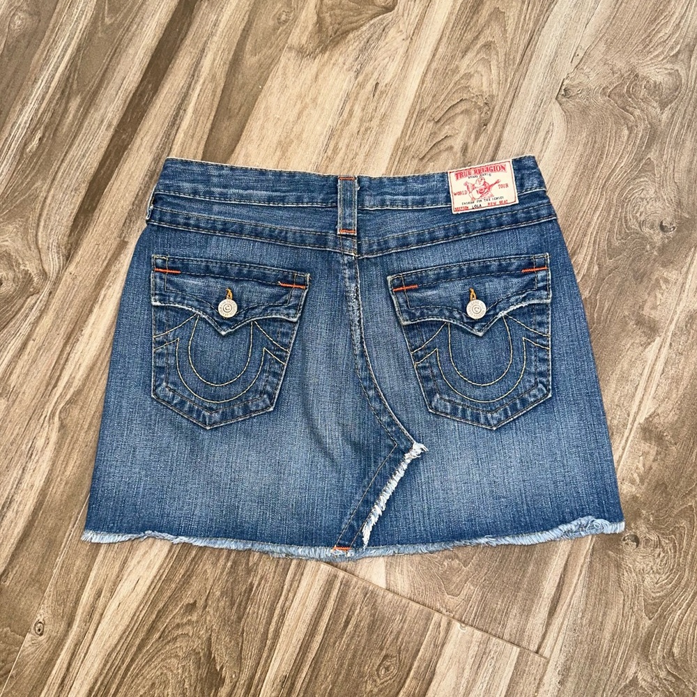 True Religion denim skirt with distressed bottom. Mint condition. Size 28